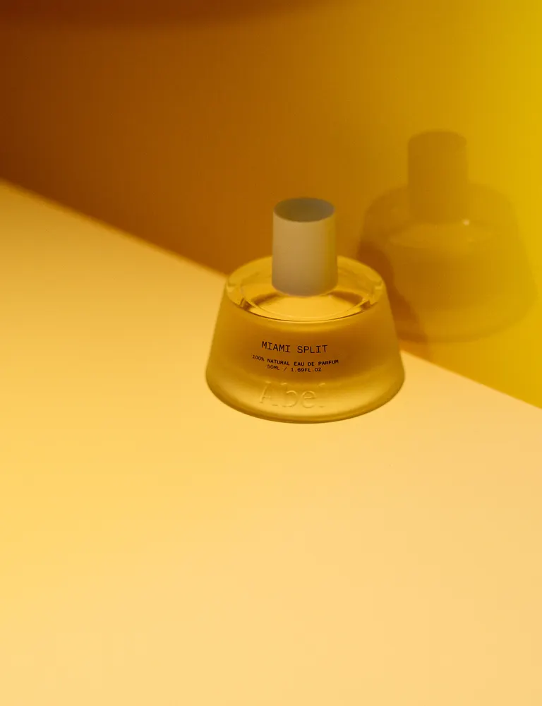 Perfume bottle in warm yellow light